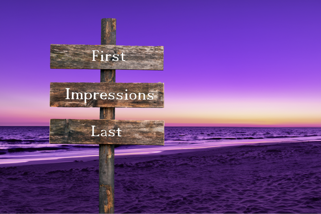 Purple beach scene with water and sand. Sign says "First Impressions Last"